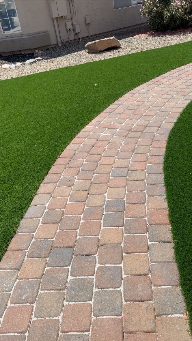 Curved paver walkway through new turf