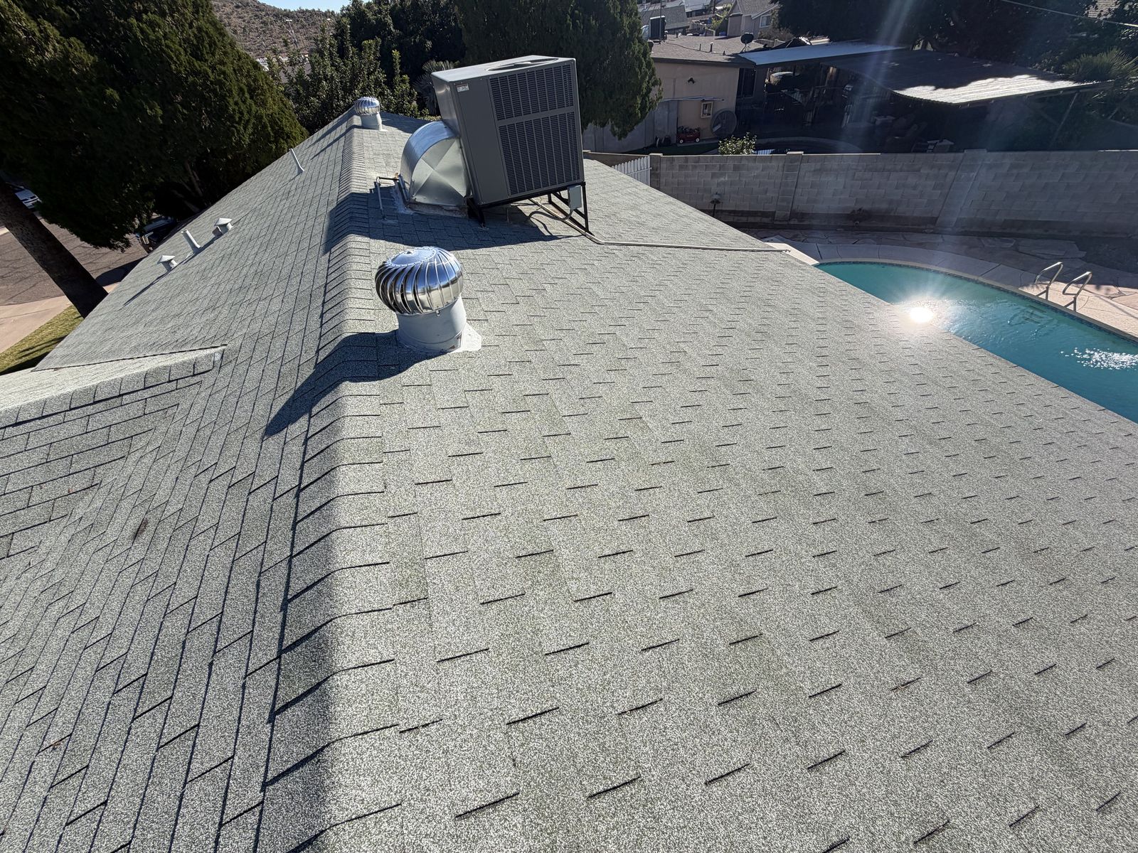 Finished architectural shingle roof with new vents