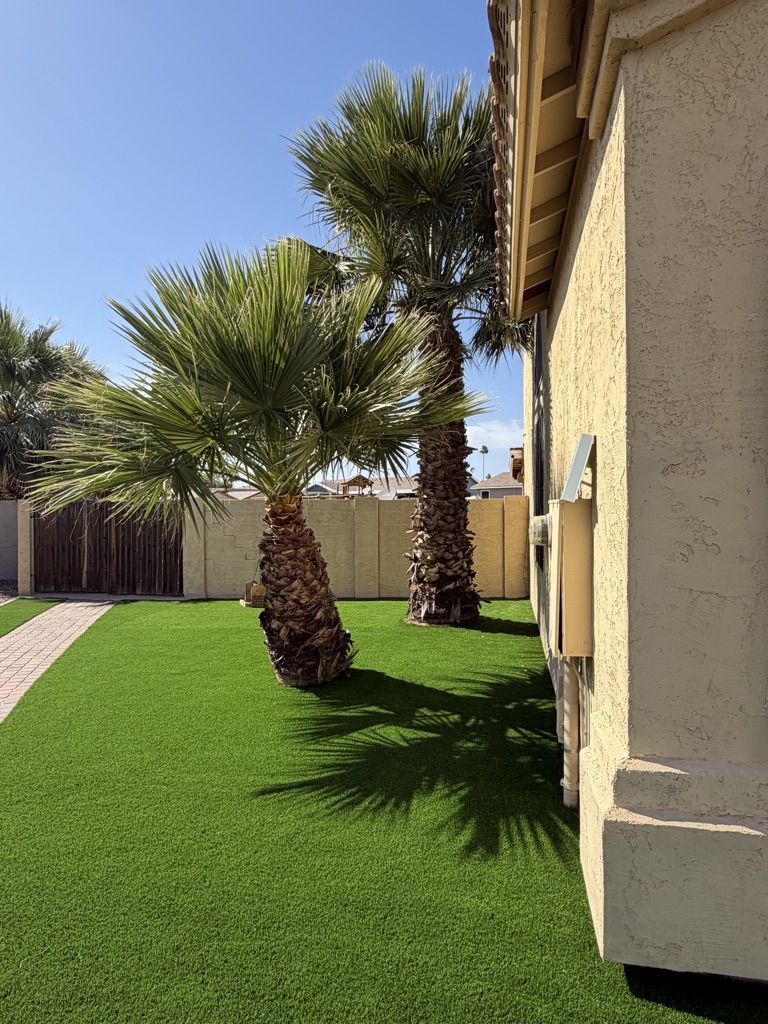 Finished side yard in artificial turf beside the house