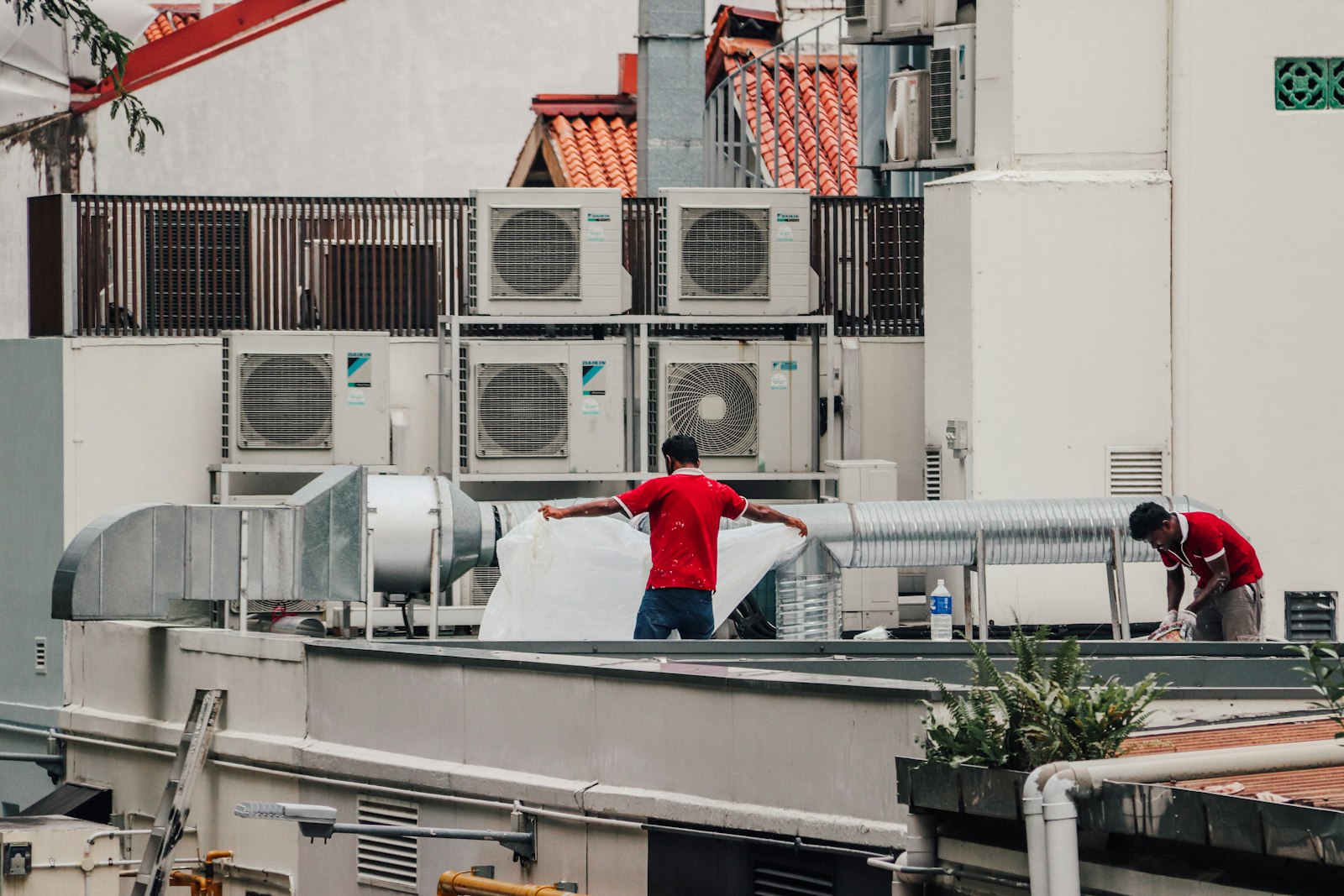 Rooftop air conditioning units and ductwork on a flat roof
